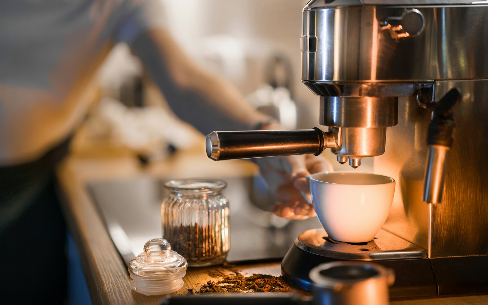 A coffee maker is making a cup of coffee