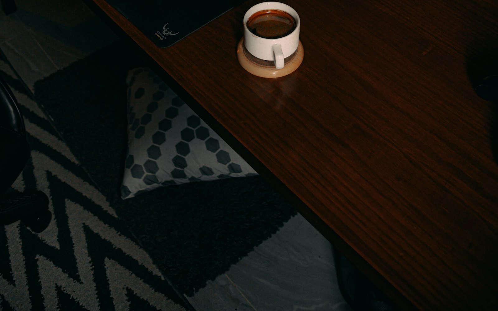 Coffee cup on wooden workspace desk